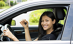 Young lady shows off new car keys